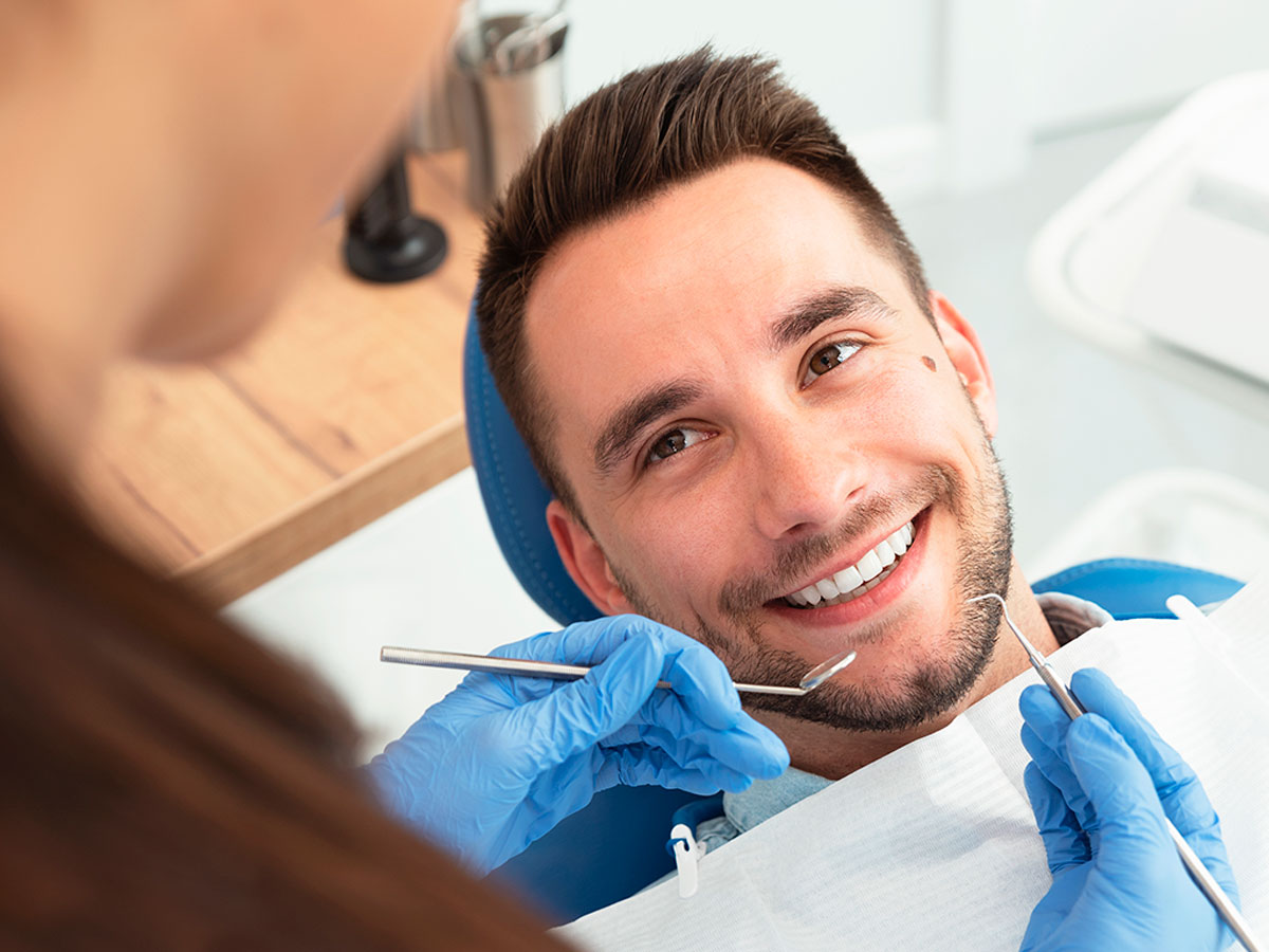 Man Receiving A Dental Treatment In JFK-LGA 