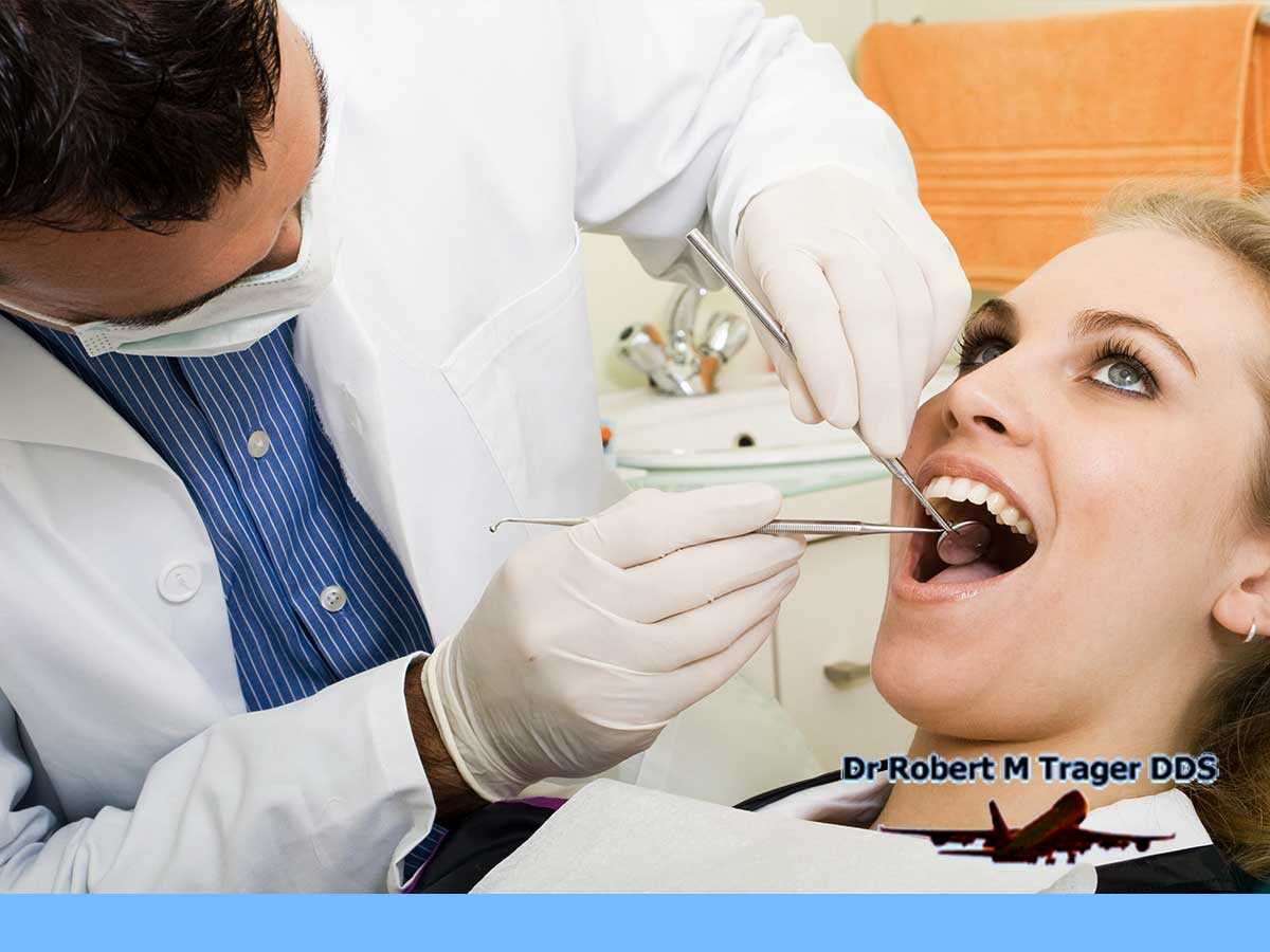 Professional Queens Dentist Checking For Dental Caries